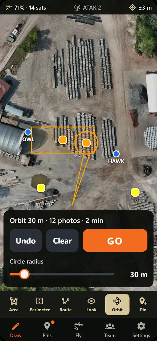 Phone screen: an orbit around a point with a radius slider.